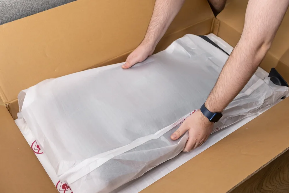 Emballage professionnel FLS Moving avec cartons et papier bulle